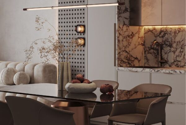 Modern dining and kitchen area featured in an interior design portfolio example, showcasing elegant marble surfaces, warm lighting, and minimalist furniture arrangement.