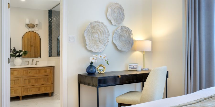Contemporary bedroom and vanity area featured in an interior designer portfolio, highlighting elegant lighting, natural textures, and cohesive design details.