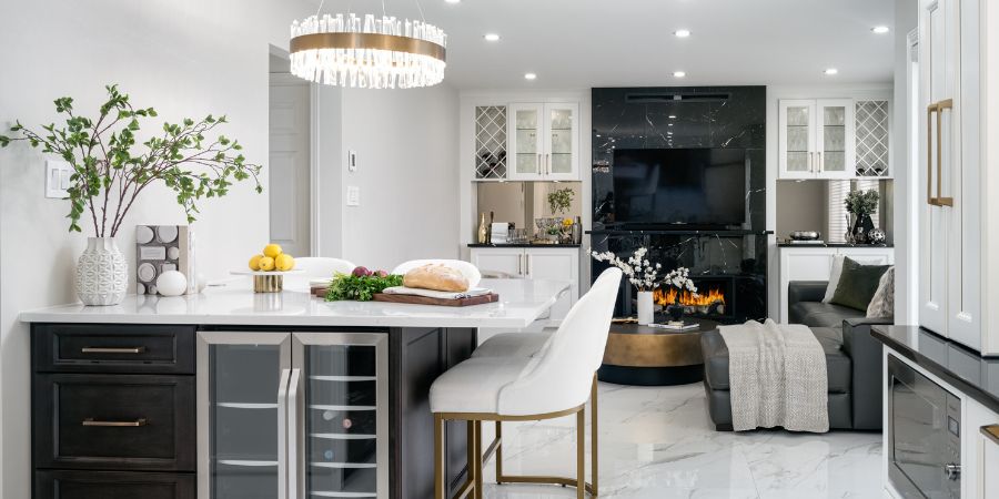 Open concept kitchen and living space with elegant finishes and cohesive decor, shown as part of an interior design portfolio PDF example for professional presentation.