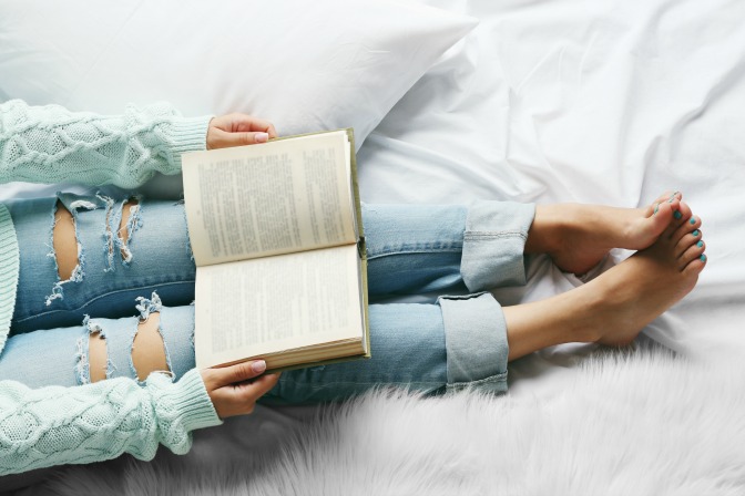 Woman reading top books interior design