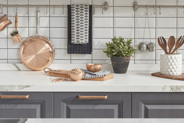 Background modern tiles wall, white table with modern kitchen accessories, interior design U