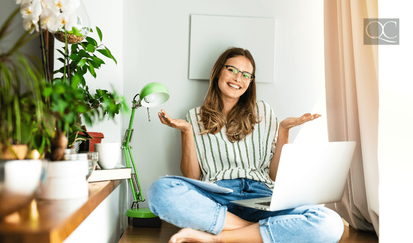 happy woman at home on laptop